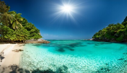 Fototapeta premium serene beach cove with crystal clear waters and lush tropical foliage under a bright sun