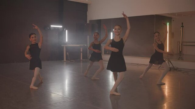 Young girls in dance class performing incredibly majestic dancing