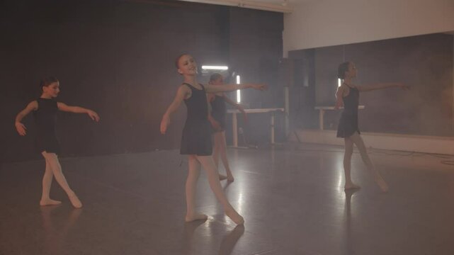 Young girls in dance class performing incredibly majestic dancing