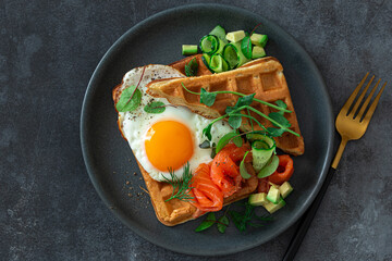 fried egg, smoked salmon, avocado and cucumber waffle