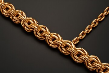 Obraz premium Luxurious golden chain necklace on dark backdrop radiating opulence and wealth in a studio shot with jewelry photography style and high detail