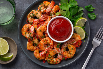 grilled shrimps served with lime, coriander leaves and tomato sauce