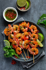 grilled shrimps skewers with green chimichurri sauce