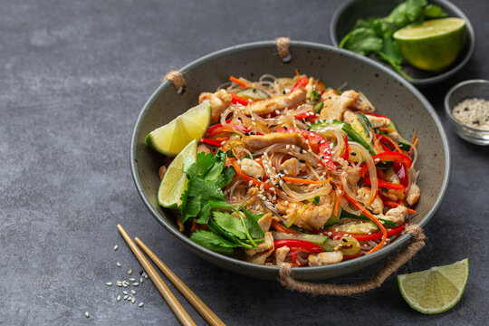 hot and spicy rice noodles with chicken and  vegetables