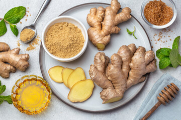 sliced fresh ginger root,  ginger powder, honey and mint leaves