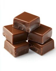 Delicious stack of glossy milk chocolate fudge squares on a white background studio shot sweet treat dessert indulgence