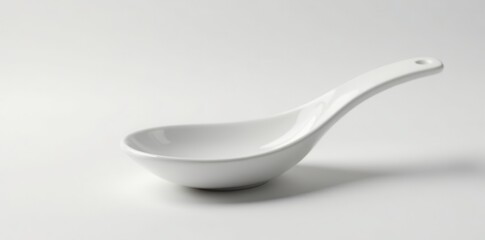 Sleek white ceramic spoon, smooth surface, studio shot , background, macro