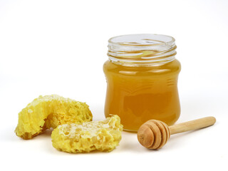 Natural organic honey in glass jar isolated - on white background