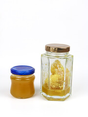 Natural organic honey in glass jar isolated - on white background