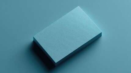 minimalistic photo of single credit card placed diagonally on solid-colored background