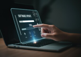 Software update progress on laptop display with hand touching the screen