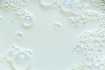 Background, close-up macro milk texture,Macro milk surface close-up,Macro milk texture,White surface of milk and bubbles and ripples from above birds eye view