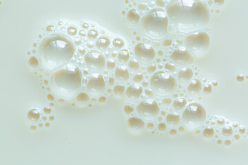 Background, close-up macro milk texture,Macro milk surface close-up,Macro milk texture,White surface of milk and bubbles and ripples from above birds eye view