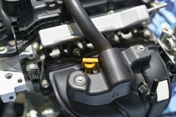 Close-Up of Engine Dipstick in Modern Car&rsquo;s Intake System..