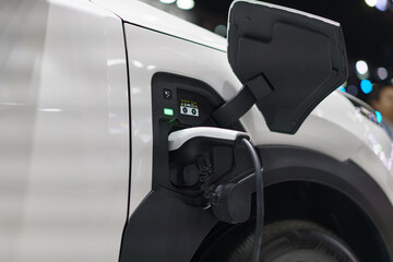 Electric Car Charging Port with Plugged-In Cable
