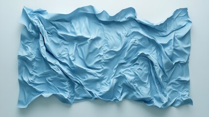 Obraz premium Light Blue Fabric Cascading Elegantly Against a Soft White Backdrop Creating a Serene and Minimalist Aesthetic for Modern Design Projects
