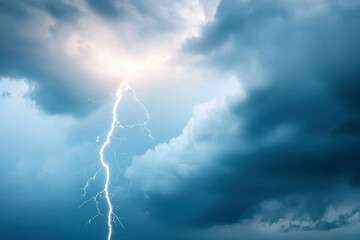 Dramatic lightning bolt striking through dark and cloudy sky during thunderstorm