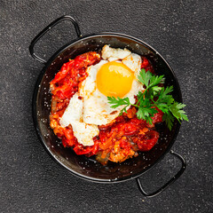 Fried egg tomatoes shakshuka vegetable dish appetizer fresh delicious gourmet food background on the table rustic food top view copy space vegetarian  food