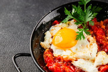 Fried egg tomatoes shakshuka vegetable dish appetizer fresh delicious gourmet food background on the table rustic food top view copy space vegetarian  food