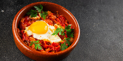Fried egg tomatoes shakshuka vegetable dish appetizer fresh delicious gourmet food background on the table rustic food top view copy space vegetarian  food