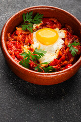 Fried egg tomatoes shakshuka vegetable dish appetizer fresh delicious gourmet food background on the table rustic food top view copy space vegetarian  food
