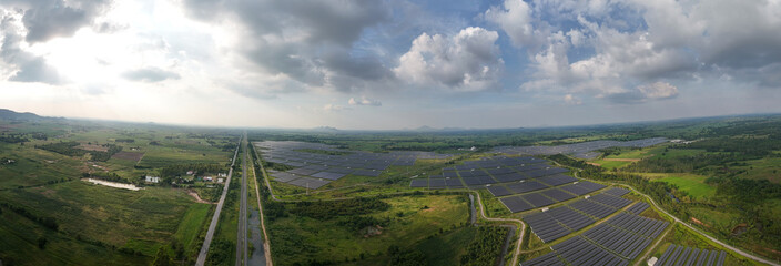 Aerial bird view photo of photovoltaic power station also known as a solar park is large-scale...