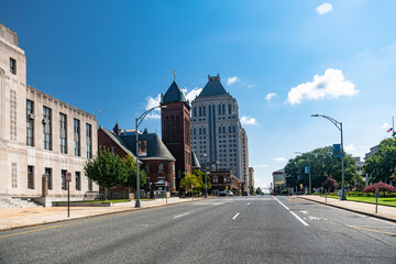 Wide roads and high-rise buildings in Greensboro, USA. Sunny day, blue sky.