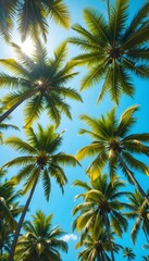Obraz premium Tropical palm trees with curved trunks and green leaves glowing under a bright blue summer sky