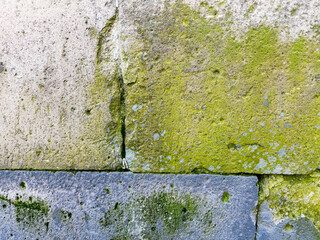Abstract old damaged stone wall texture as background, closeup