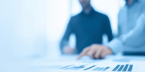Business professionals analyzing financial data on a report with charts and graphs in a modern office environment, teamwork and collaboration concept