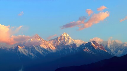 Majestic snow-capped mountains under golden sunlight with blue sky and pink clouds.