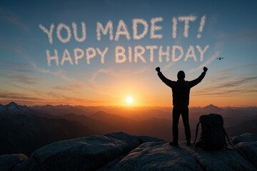 Adventurer celebrating birthday at mountain sunrise with inspirational message in skywriting