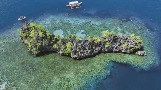 4K Drone View Of Seven Islands of Siete Pecados, Coron island, Palawan, Philippines
showcases the cluster of seven distinct islands surrounded by vibrant blue and crystal clear waters