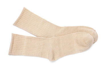 Pair of beige socks isolated on white, top view