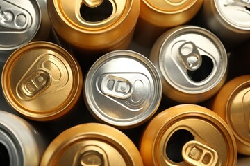 Many different tin cans as background, top view