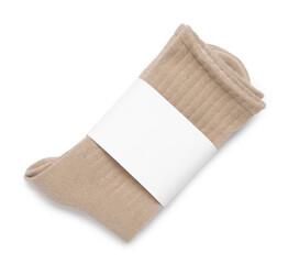 Pair of beige socks isolated on white, top view