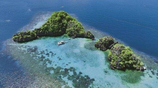 4K Drone View Of Seven Islands of Siete Pecados, Coron island, Palawan, Philippines
showcases the cluster of seven distinct islands surrounded by vibrant blue and crystal clear waters