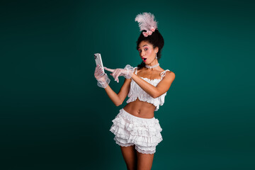 Modern young woman dressed in elegant baroque-inspired costume, capturing a moment of surprise...