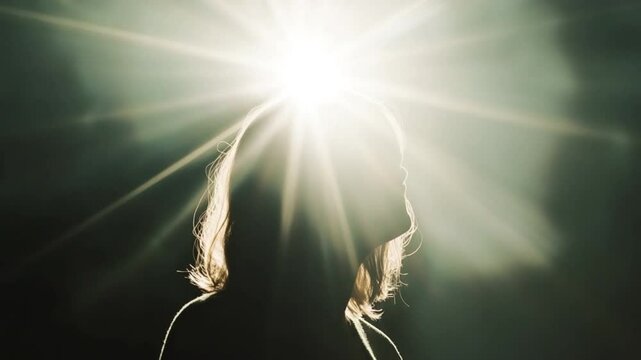 Shining Light on Inner Self: A captivating silhouette of a person emerges against the bright sun, representing the brilliance of insight, knowledge, and spiritual awakening.