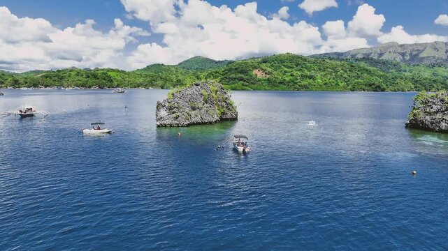 4K Drone View Of Seven Islands of Siete Pecados, Coron island, Palawan, Philippines
showcases the cluster of seven distinct islands surrounded by vibrant blue and crystal clear waters