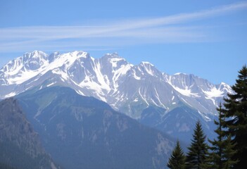Obraz premium Majestic Snow Capped Mountain Range under a Clear Blue Sky A breathtaking view of a pristine alpine landscape