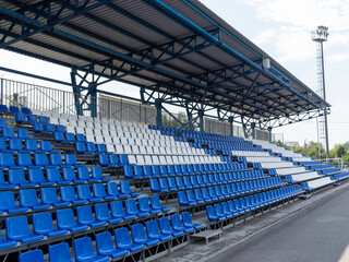 Armchairs seats blue chairs at the sport stadium