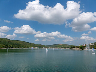Abrau Durso, Russia 28 August 2024: Panoramic view of the lake Abrau-Durso with sailboats on a sunny day