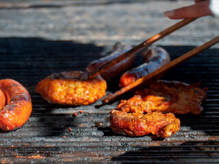 Grilling German Sausages, Meatballs and Patties Outdoors