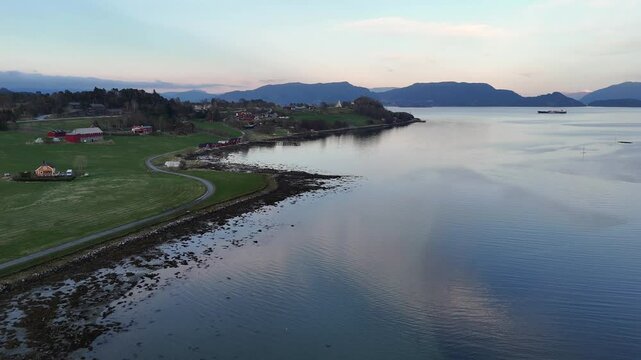 Drone gliding toward Frei Church at Rastarkalv, where King Haakon fought the sons of Eirik Bloodaxe
