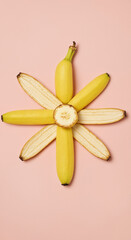 Banana Flower Neatly Organized Against Light Pink Background With Copy Space. Banana peel