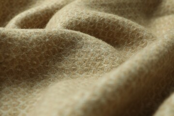 Beige woolen fabric with geometrical pattern, closeup