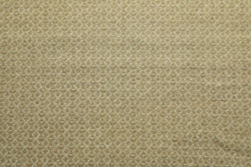 Fototapeta premium Beige woolen fabric with geometrical pattern as background, top view