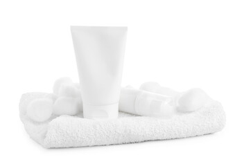 Cosmetic products, cotton balls and towel isolated on white