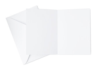 Blank greeting card and paper envelope on white background, top view